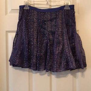 Purple mini skirt with pink flowers &gold accents.
